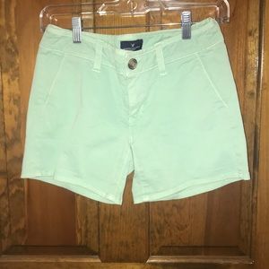 Light blueish/green shorts